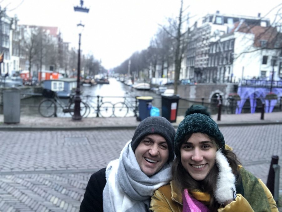 Levent Kutlu and his spouse beside an Amsterdam canal