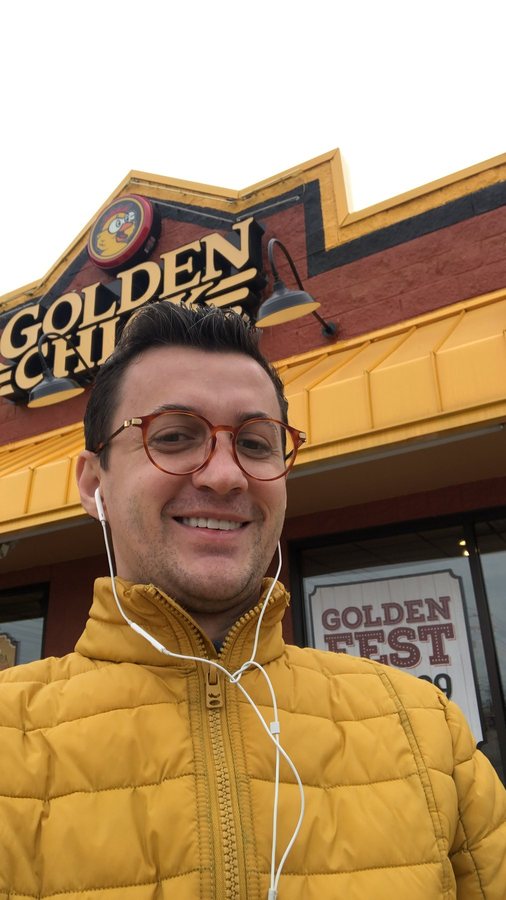 Levent Kutlu, UTRGV economics professor, wearing a yellow winter jacket outdoors in Texas