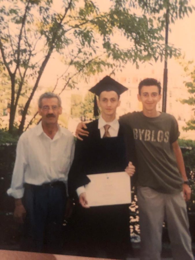Levent Kutlu in a graduation photograph with family