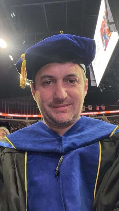 Levent Kutlu wearing academic regalia at a UTRGV commencement ceremony