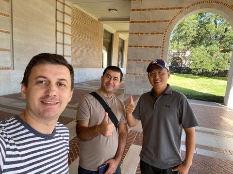 Levent Kutlu with friends from his Rice University PhD years on the Rice campus